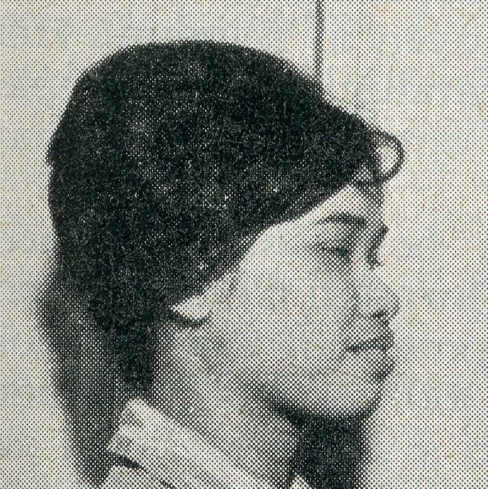 Black and white profile portrait of a young woman with dark hair.